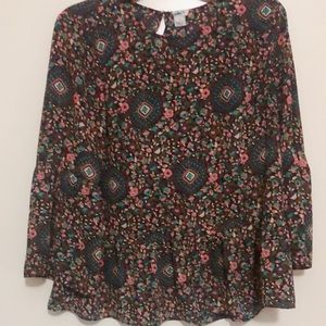 J. Crew print top with ruffle hem.